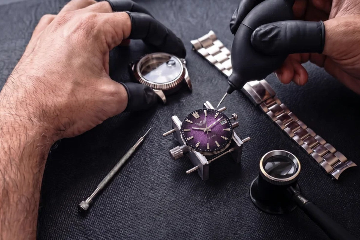 Watchmaker assembling an RF watch by hand